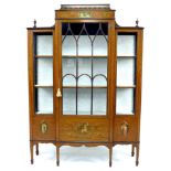 An Edwardian Sheraton style satinwood veneered breakfront display cabinet, the whole with painted