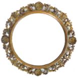 A 19th century Continental giltwood wall mirror, with foliate, floral and shell carved frame