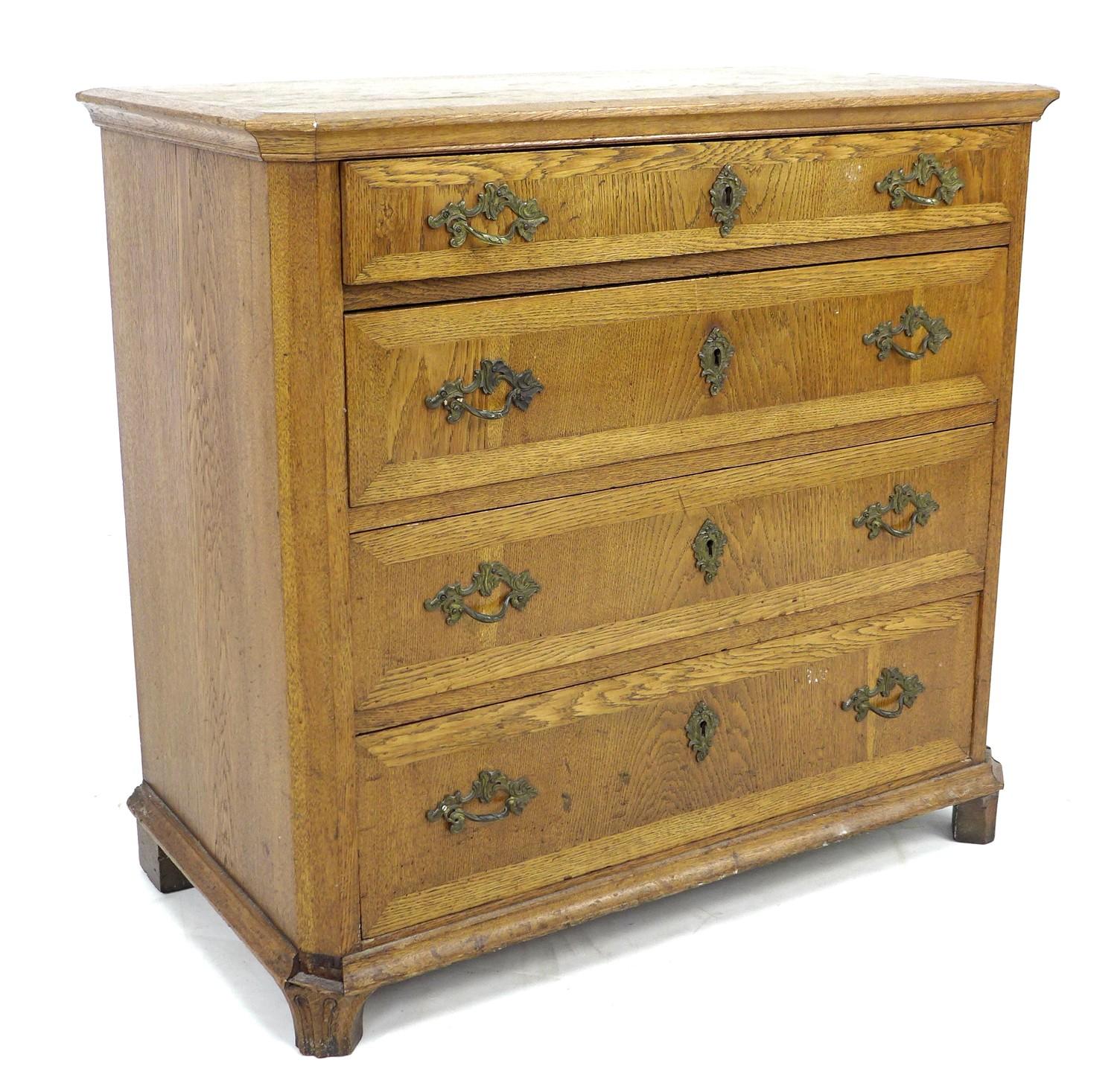 A late 19th century Danish oak chest of four graduating drawers, with brass handles and escutcheons,