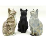 A group of three Northshore Ceramic cats, all the same casting but of differing colours and glaze