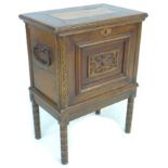 A 20th century oak chest on stand, the lift lid with elm inlay and large brass hinges opening to