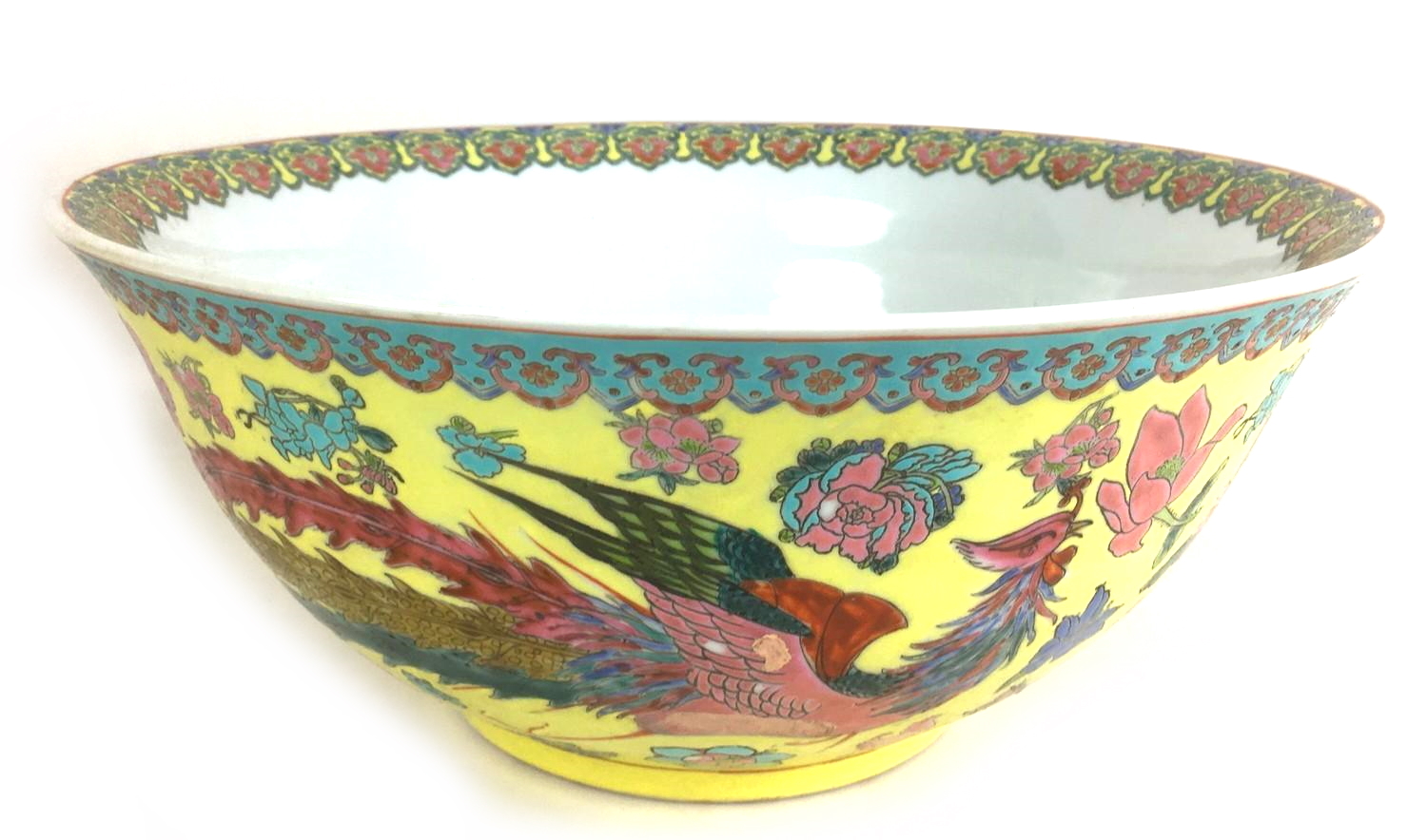 A large Chinese 20th century bowl, decorated with a floral rim to its interior and a phoenix and