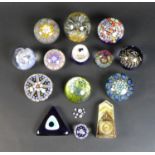 A group of fourteen various paperweights, including five millefiori paperweights, featuring a