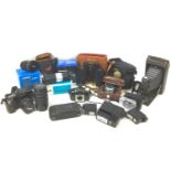 A collection of cameras and accessories, including, a Canon EOS 100 camera, a Canon Ultrasonic