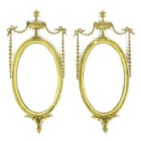 A pair of early 19th century Neoclassical taste gilt composition wall mirrors, in Hepplewhite,