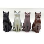 A group of North Shore pottery, comprising four ceramic cats two signed JMR on base, height of