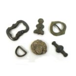 A group of six Medieval and later detectorist finds, comprising a strap fitting, of subovate central
