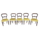 A set of five Victorian balloon back chairs, with decorative carved laurel leaf splats,