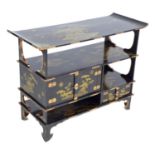 A low Japanese black lacquer shelf unit, Meiji period, with engraved copper mountings, decorated