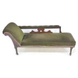 An Edwardian stained oak chaise longue, 176 by 61.5 by 71cm high.