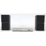 A vintage Bang & Olufsen Beocenter 1400, 66 by 81.5 by 25.5cm high, together with a pair of Beovox