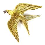 An 18ct yellow gold brooch in the form of a bird, swift or swallow, modelled with outstretched wings