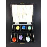 A cased set of six enamel coffee spoons, with coffee bean finials, each 9.3cm long, William Suckling