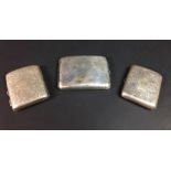 Three George V silver cigarette cases, comprising