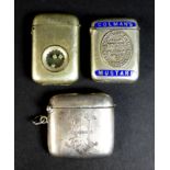 A group of three vesta cases, comprising a Victorian silver example of curved rectangular form,
