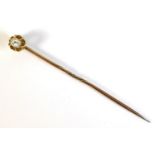 A Victorian unmarked yellow gold diamond set stick tie pin, the 0.15ct, 3.5 by 3.0 by 1.5mm, oval