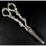 A pair of Victorian silver grape scissors, with ornate handles decorated with vines and grapes, H
