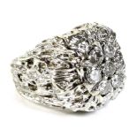 An American 14K white gold over yellow gold diamond cluster ring, of unusual modernist design, circa