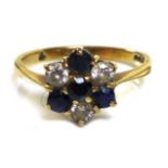 A 9ct gold, diamond and sapphire flowerhead ring, central round cut sapphire set about with three
