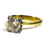 A diamond and 18ct gold and white gold solitaire ring, the diamond of approximately 1ct,