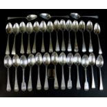 A collection of thirty Georgian and Victorian silver dessert spoons, comprising a George III old