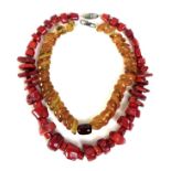 An irregular beaded amber necklace, 41cm long, 64g, together with a red coral necklace, 55cm long (