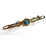 A 9ct gold turquoise and seed pearl bar brooch, with central flowerhead design, adjoined by two gold