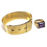 A 9ct gold buckle bangle bracelet, 14.8g, together with a modernist design 9ct gold and emerald