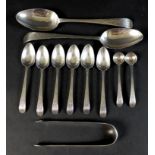 A suite of similar George III silver spoons, all Old English pattern with bright cut decoration,