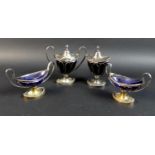 A 19th century Dutch silver cruet set, of boat shaped pedestal form, with open wirework bodies,