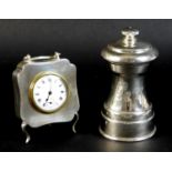 A George V silver cased travel clock of quatrefoil form, with machine turned decoration, rubbed