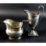 Two pieces of George III silver, comprising a helmet form milk jug, with bright cut decoration,