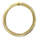 A gold Cleopatra style necklace, circa 1980, testing as 18ct, 41cm long, 48.3g.