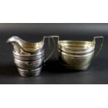 Two pieces of George III silver, comprising a twin handled sugar bowl of oval form, with reeded