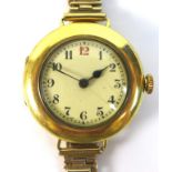 An Art Deco Baume & Company 18ct gold lady's wire lug wristwatch, circular cream dial with black