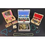 A collection of costume jewellery with three late 20th century jewellery boxes, including a