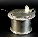 A William IV silver mustard pot, monogrammed lid with shell form thumb piece, gadrooned rim, blue