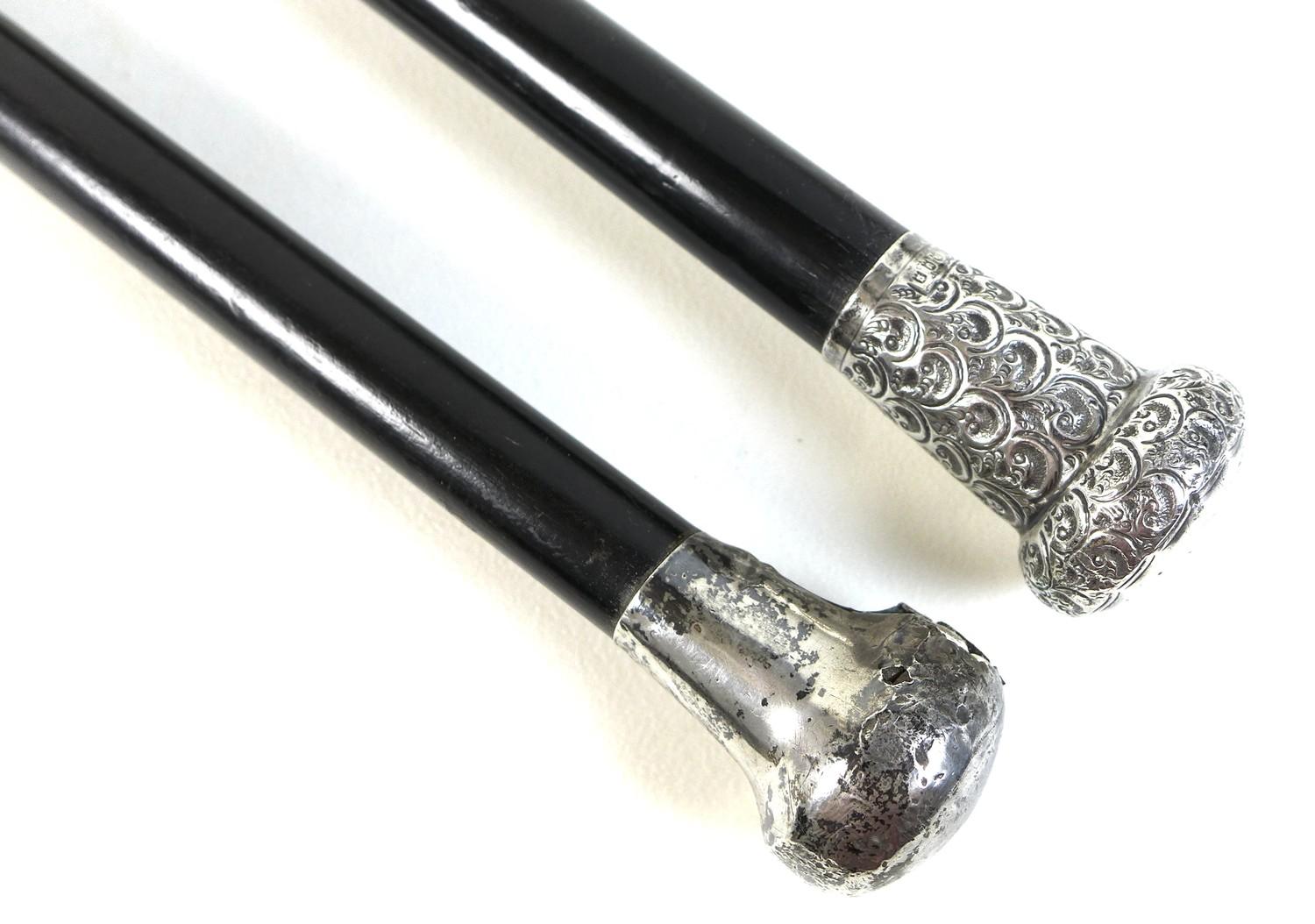 Two George V silver topped ebonised canes, one with a repousse wave patterned handle, and a silver - Image 3 of 6