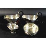 A Danish silver saucepan of circular form with swirl design to the body, silver gilt interior and