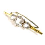 A Victorian 12ct gold three 'stone' brooch, the central square cushion cut clear glass / crystal, 17