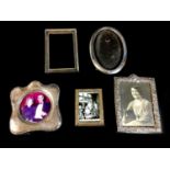 Five George V and later silver mounted photograph frames, comprising a George V oval frame,