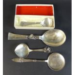 A collection of four Danish silver spoons, comprising a Georg Jensen Sterling silver commemorative
