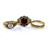 A group of three 9ct gold rings, comprising a gentlemen's ring set with an oval red stone,