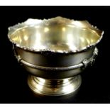 A small silver rose bowl of pedestal form with scalloped rim and lyre handles, William Henry May,