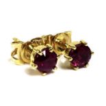 A pair of ruby stud earrings, set in 18ct gold, total weight 1g excluding butterflies.