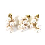 A pair of Japanese 18k gold and blush pearl cluster earrings, each with eleven cultured pearls,