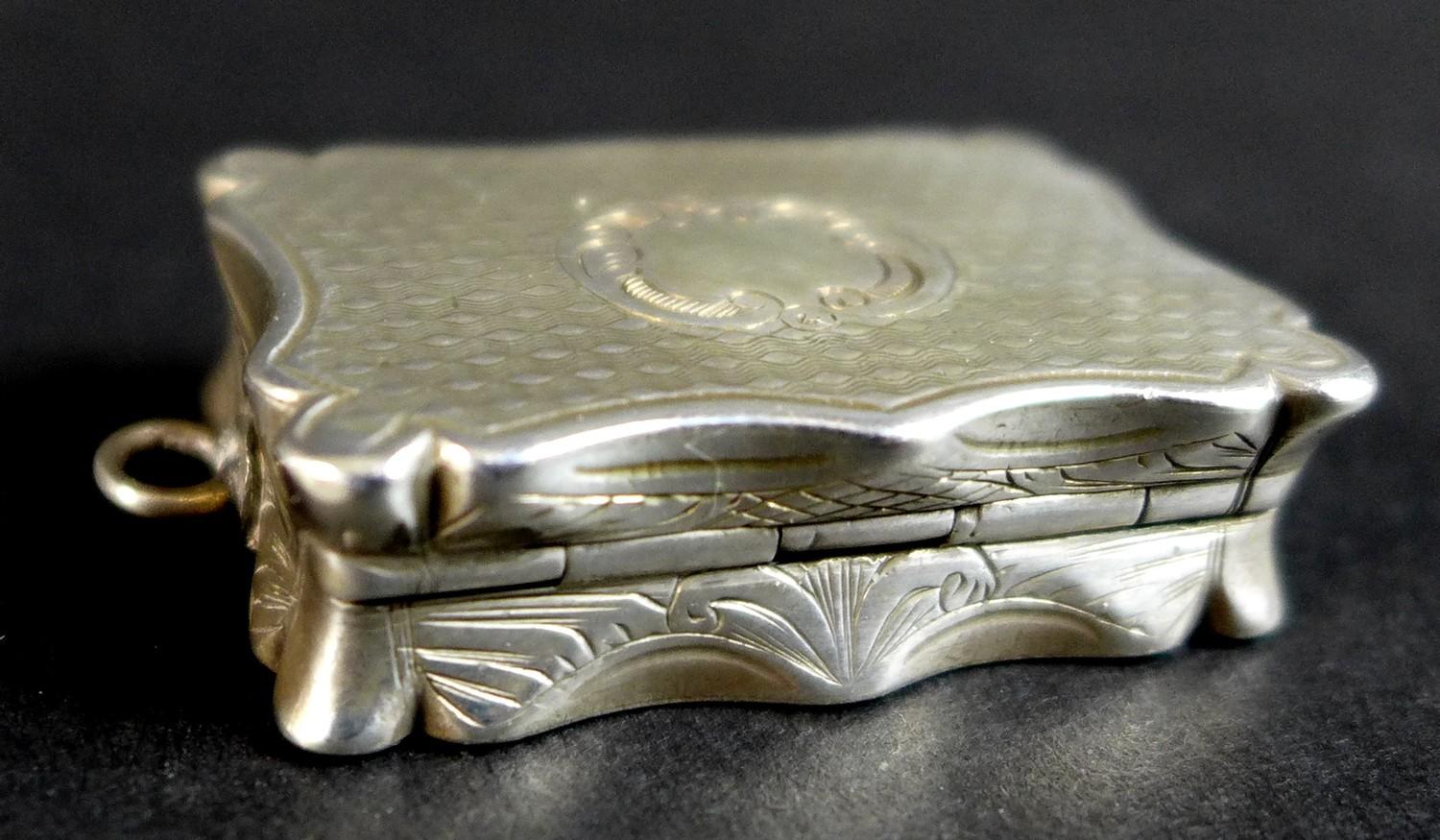 A Victorian silver vinaigrette, of shaped rectangular form, with wave engine turned decoration to - Image 3 of 7