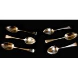A set of five plus one George III silver dessert spoons, old English pattern, all with terminals