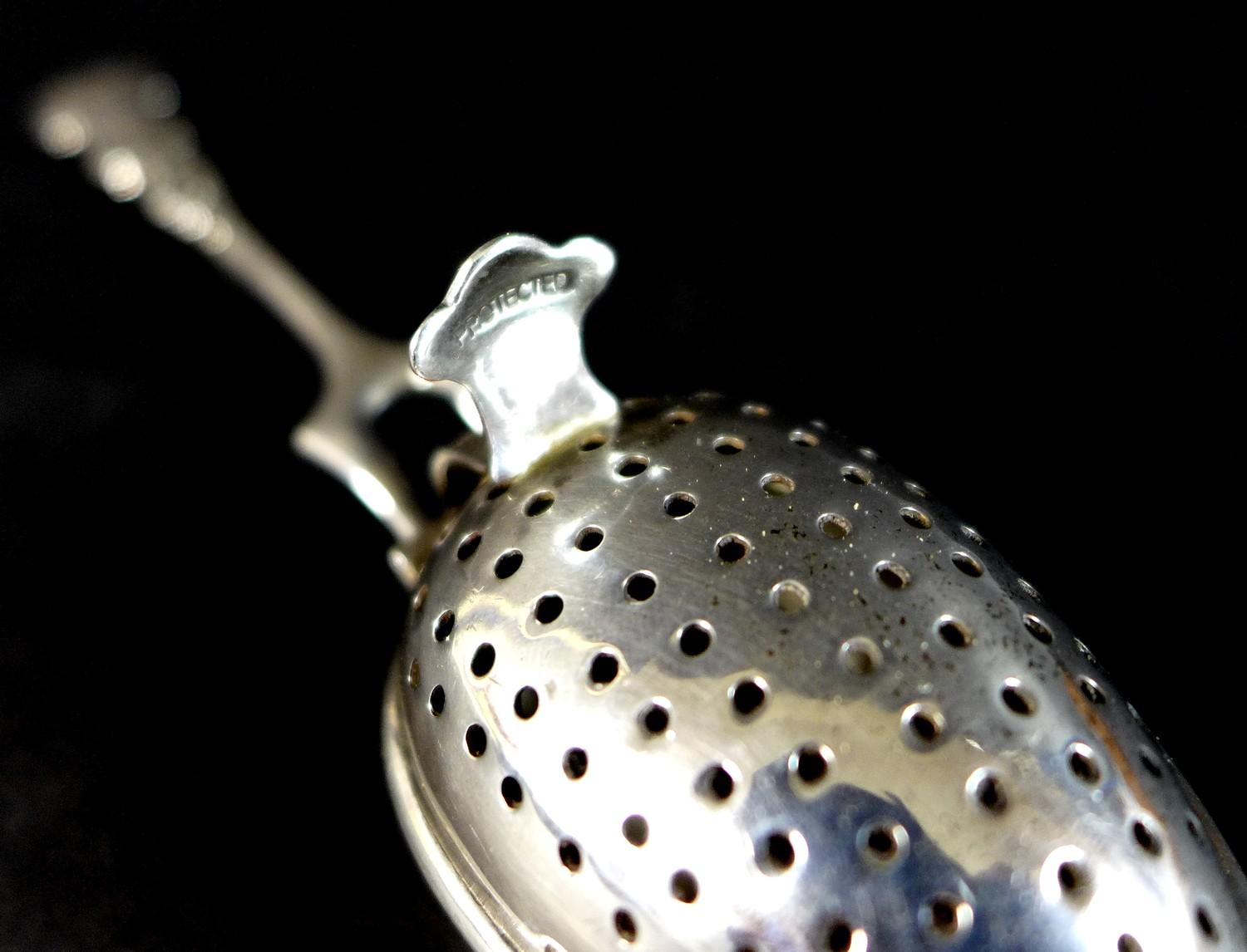 An Edward VII silver tea infuser, fancy scroll decorated handle with two pronged support to the - Image 3 of 6