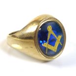 A 9ct gold Masonic gentleman's ring, the blue stone oval carved and inset with gold Freemasons logo,